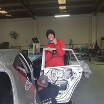 Pakenham Accident Repairs team members working on a car